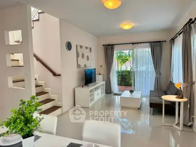 Spacious modern living room with natural light and stylish decor