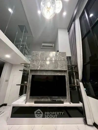 Luxurious modern living room with high ceilings and elegant marble fireplace