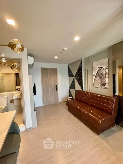 Modern living room with stylish decor and brown leather sofa