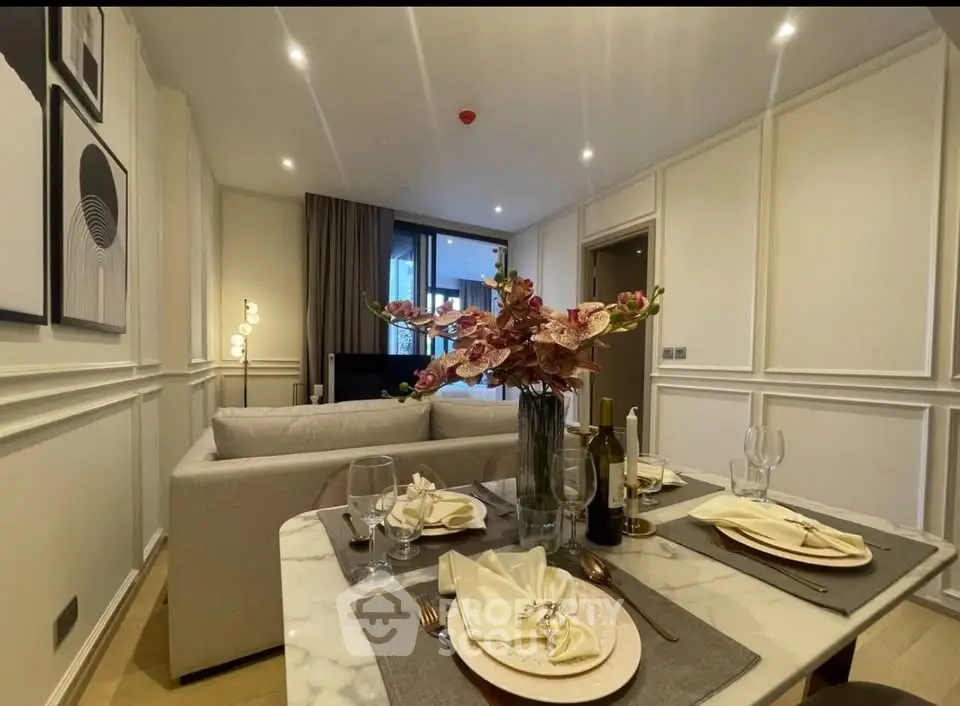 Elegant dining and living area with modern decor and ambient lighting