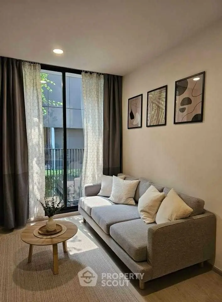 Cozy living room with modern decor and large window view