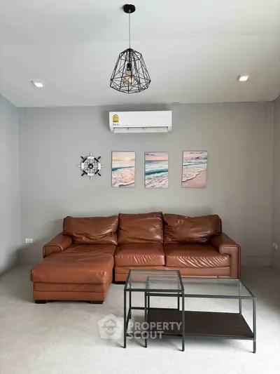 Stylish living room with leather sofa and modern decor