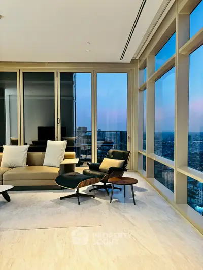 Luxurious high-rise living room with stunning city views and modern furnishings.