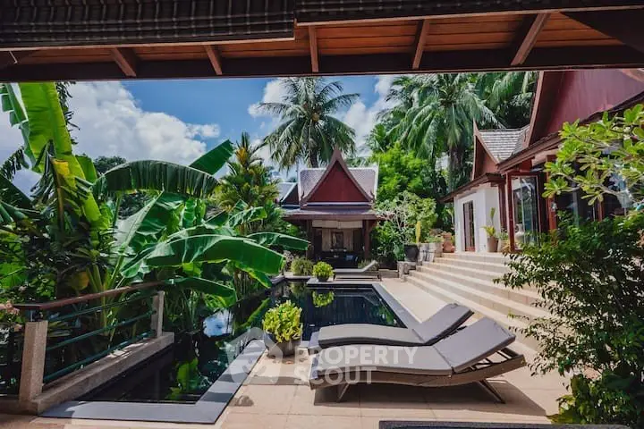 Luxurious tropical villa with private pool and lush garden, perfect for serene living.