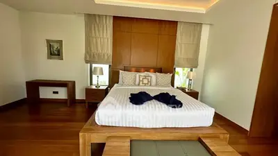 Luxurious bedroom with elegant wooden furniture and ambient lighting