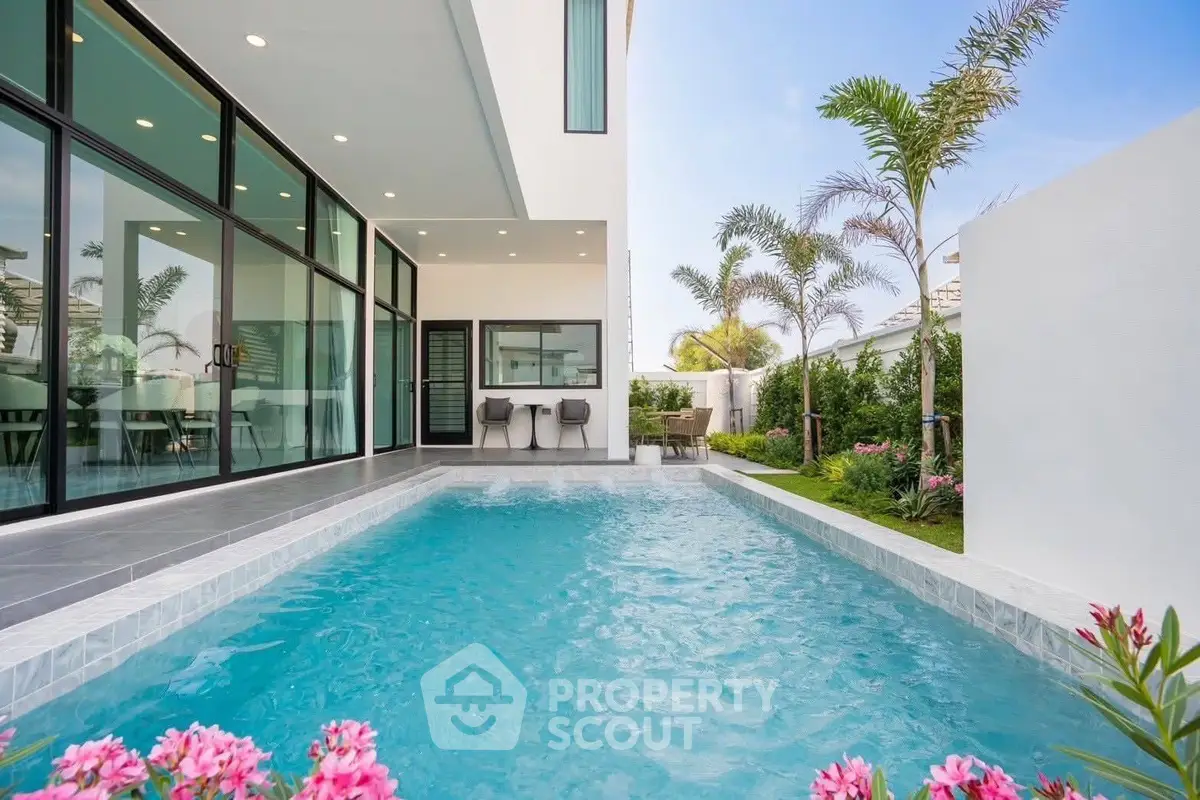 Luxurious modern home with private pool and lush garden, perfect for relaxation and entertaining.