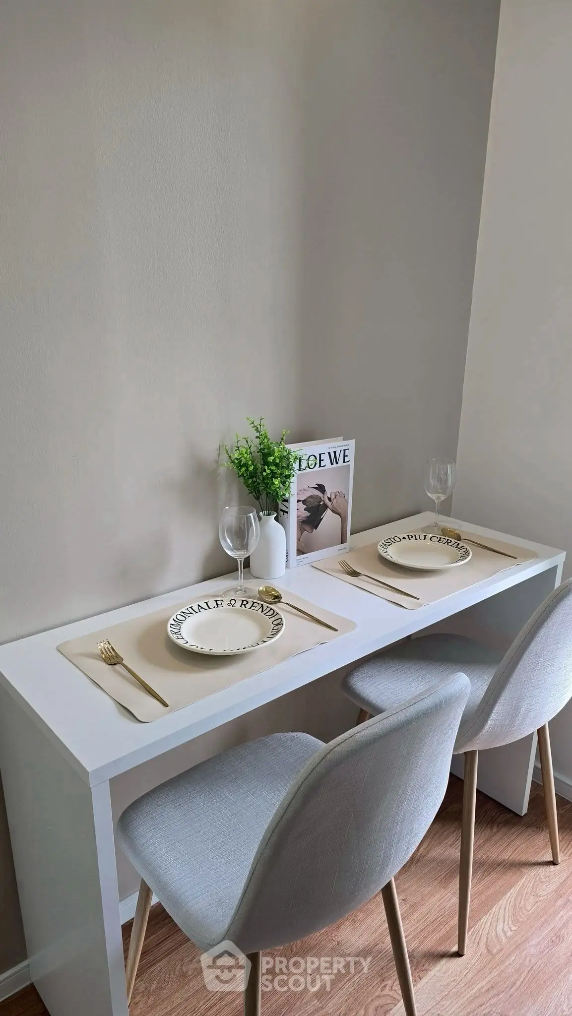 Chic dining nook with modern decor and elegant table setting in cozy apartment.