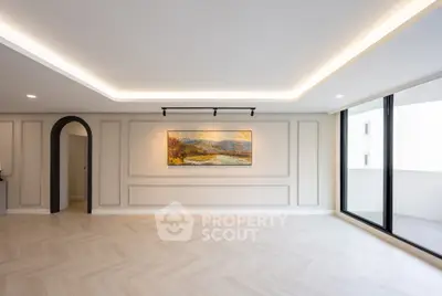 Spacious modern living room with elegant lighting and large windows