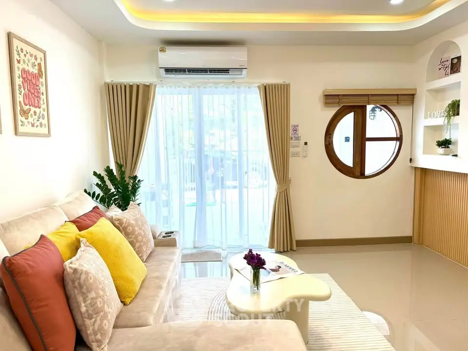 Chic living room with modern decor and large window for natural light