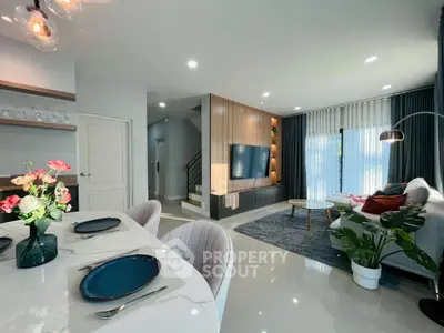 Modern open-plan living room with stylish decor and dining area