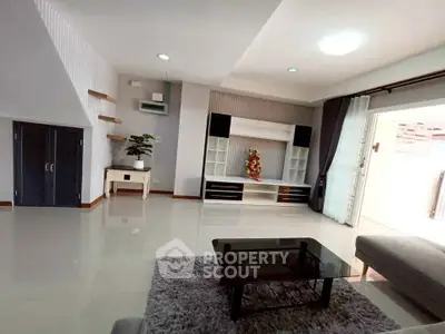 Spacious modern living room with sleek furniture and elegant decor