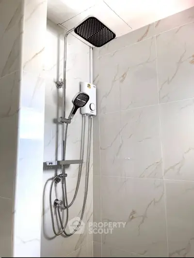 Modern bathroom shower with sleek design and marble tiles