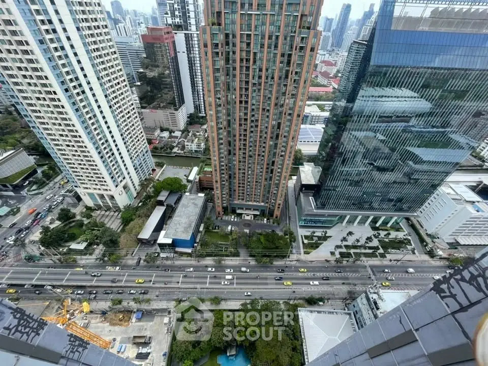 Stunning aerial view of modern skyscrapers in a bustling urban landscape, showcasing prime real estate.
