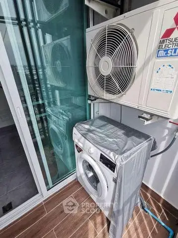 Modern balcony with washing machine and air conditioning unit, perfect for urban living convenience.
