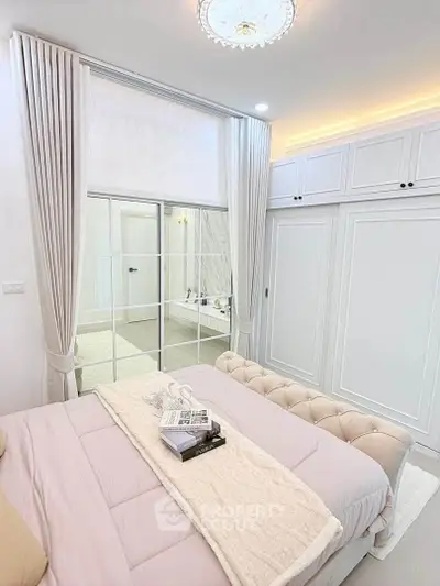 Elegant bedroom with luxurious decor and ensuite bathroom view
