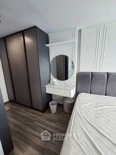 Modern bedroom with sleek wardrobe and stylish decor