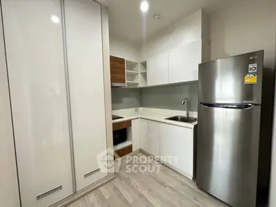 Modern kitchen with sleek appliances and ample storage space