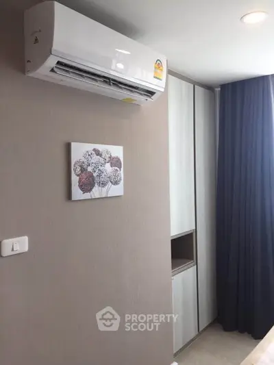 Modern bedroom with air conditioning and stylish decor