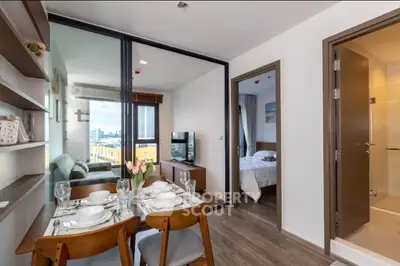 Modern apartment interior with dining area and city view