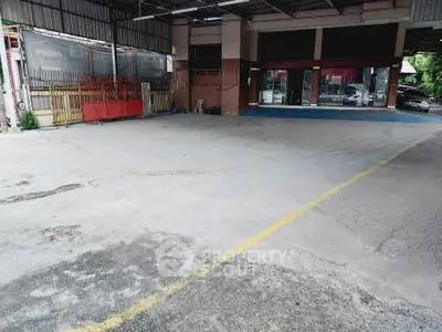 Spacious covered parking area with easy access and ample space for multiple vehicles.