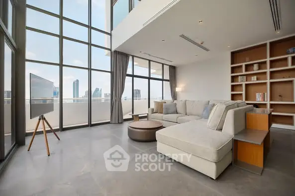 Luxurious modern living room with floor-to-ceiling windows and city view