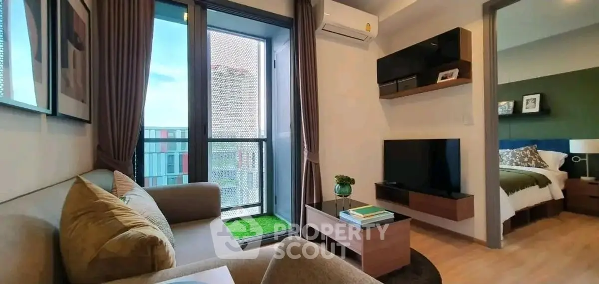 Modern living room with balcony view and stylish decor in urban apartment