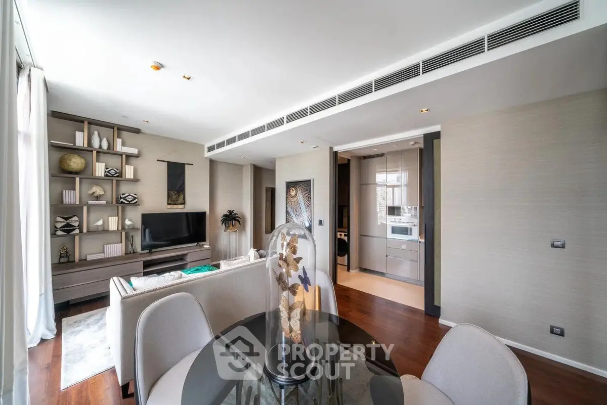 Modern living room with elegant decor and open kitchen layout