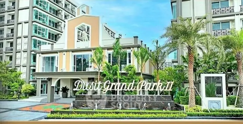 Luxurious modern apartment complex with lush landscaping and elegant entrance.