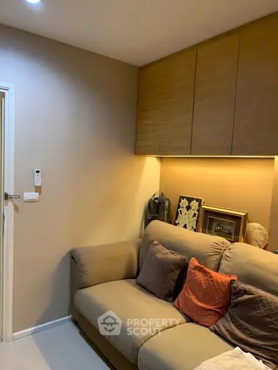 Cozy living room with modern sofa and ambient lighting