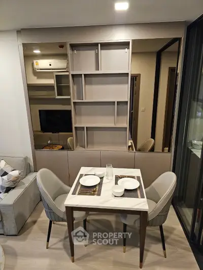 Modern living room with stylish dining area and built-in shelving