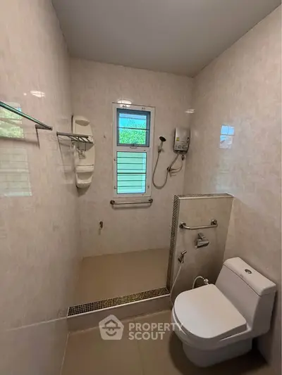 Spacious bathroom with modern fixtures and natural light