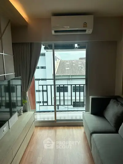 Modern living room with balcony view and air conditioning