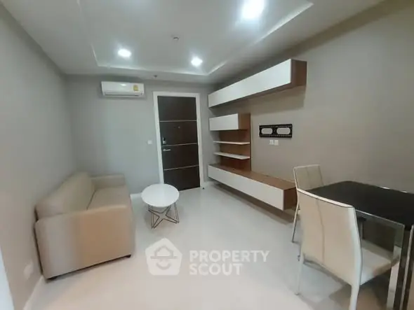 Modern living room with sleek furniture and neutral tones