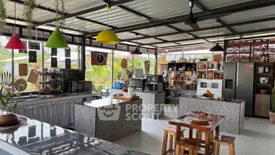 Spacious open kitchen with modern appliances and ample natural light.