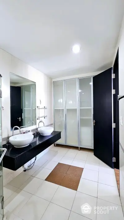 Spacious modern bathroom with dual sinks and sleek design