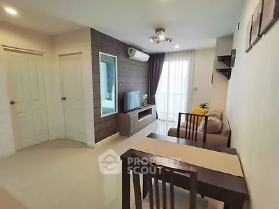 Modern living room with sleek furniture and natural light, perfect for relaxation and entertainment.