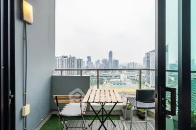 Charming balcony with city skyline view, perfect for relaxing and enjoying urban living.