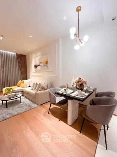Elegant living and dining area with modern decor and cozy ambiance.