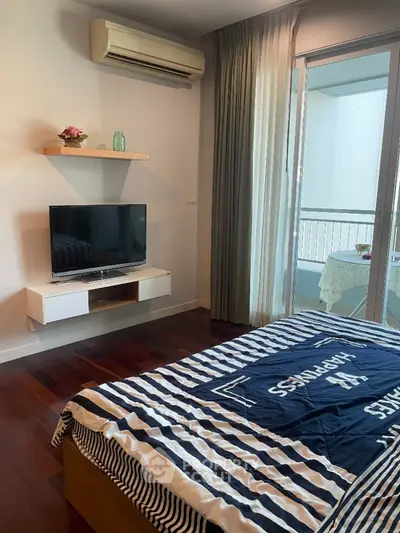 Modern bedroom with balcony access and stylish decor
