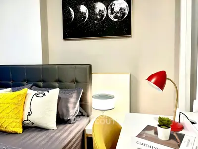 Stylish bedroom with modern decor and cozy lighting