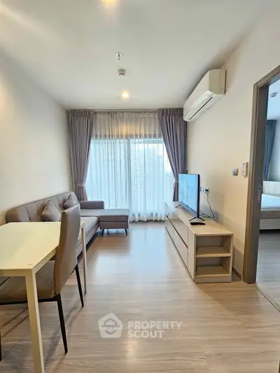 Modern living room with sleek furniture and natural light, perfect for urban living.