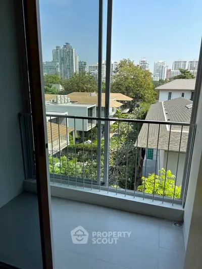 Charming balcony with city view, perfect for relaxation and enjoying urban scenery.