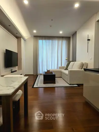 Modern living room with elegant decor and wooden flooring