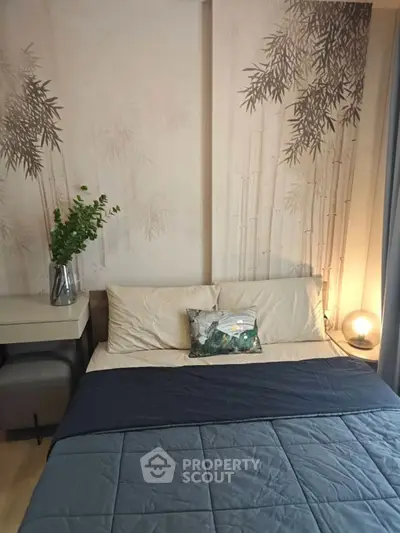 Cozy bedroom with elegant bamboo-themed wallpaper and modern decor