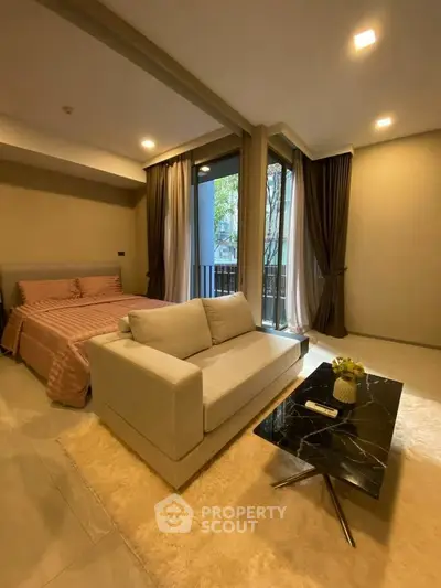 Cozy bedroom with modern decor and natural light in a stylish apartment.