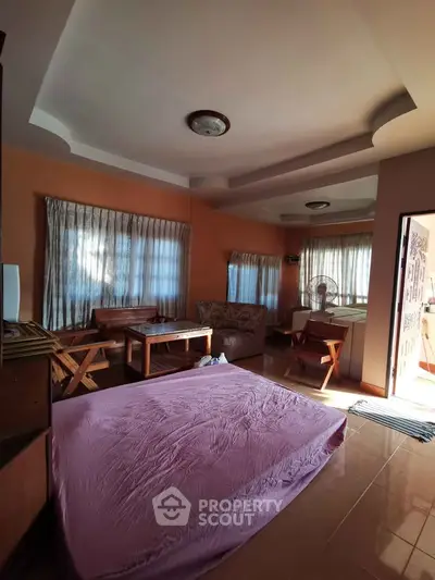 Cozy living room with natural light and simple furnishings