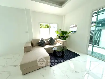 Bright modern living room with stylish sofa and glass coffee table