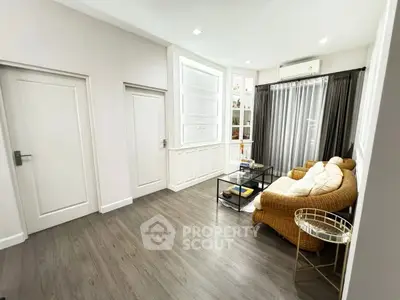 Charming living room with cozy wicker sofa and elegant decor