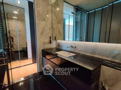 Luxurious modern bathroom with marble accents and sleek fixtures