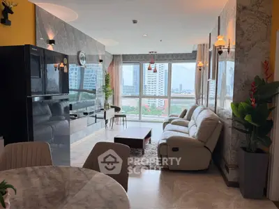 Luxurious living room with stunning city view, elegant decor, and plush seating in a high-rise apartment.